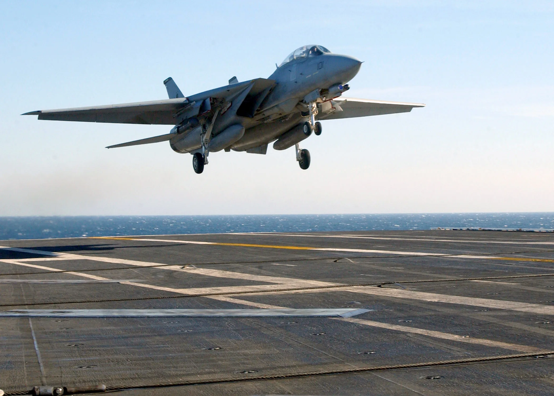 Family-level photograph of a U.S. Navy F-14D Tomcat from VF-213 landing aboard USS Theodore Roosevelt in 2003; this is not identified as the F-14D(R).