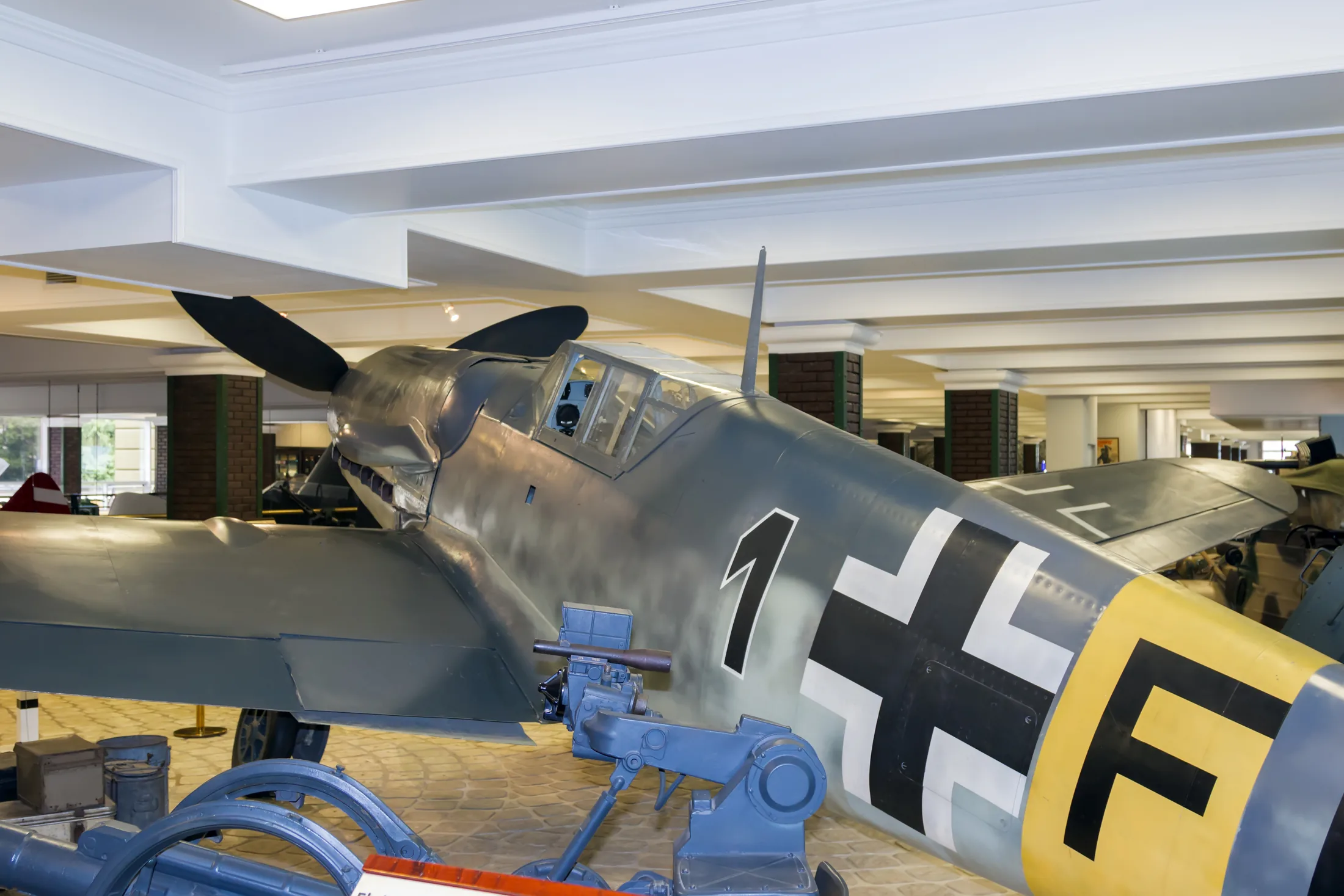 Family-level photograph of a Messerschmitt Bf 109 G-6 displayed in a museum; not identified as the G-6/R3 variant.